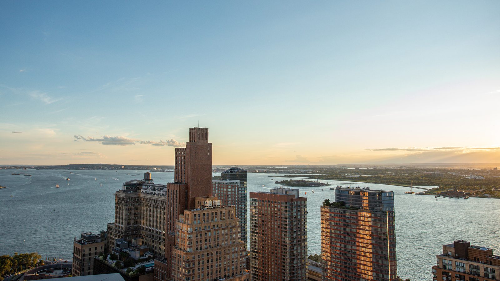 Battery Park City and the harbor at golden hour from 77 Greenwich
