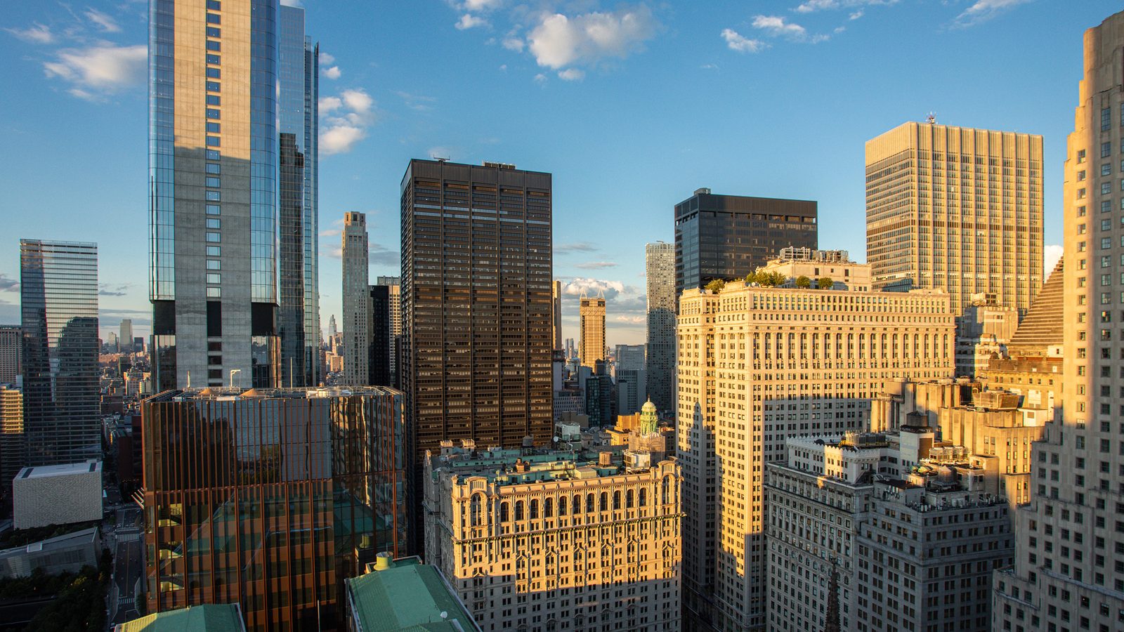 The landmarked towers of Lower Manhattan at golden hour from 77 Greenwich