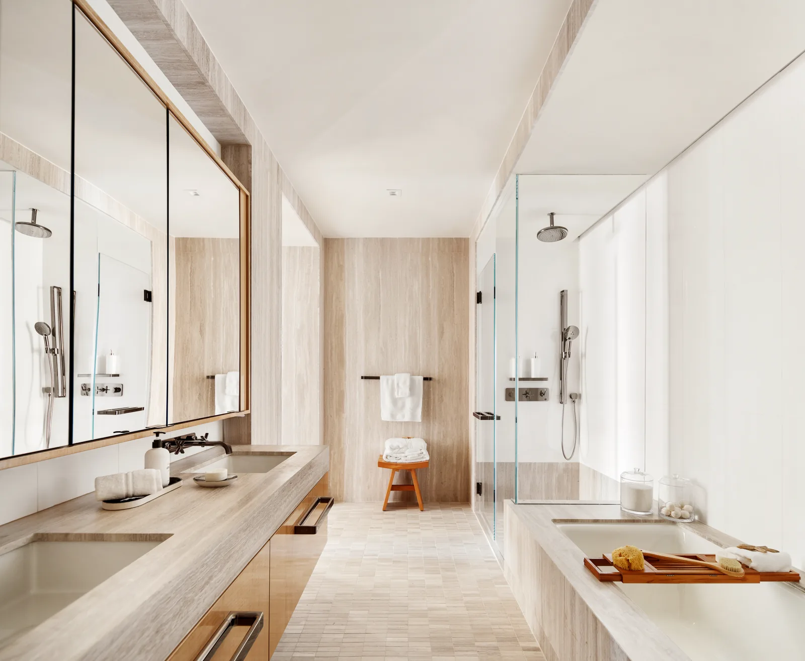 Primary bath with floor-to-ceiling stone finishes and heated floors
